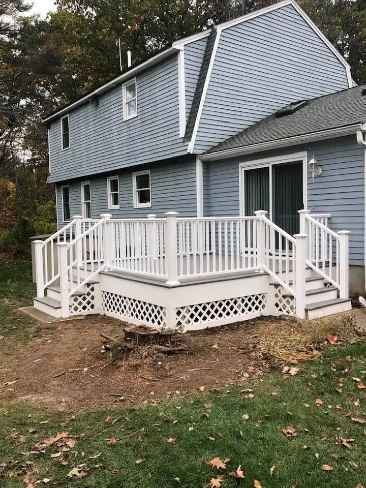Finished deck with white rails and lattice skirting